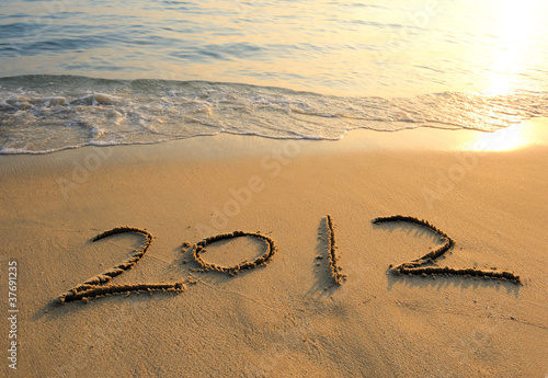 Obraz na płótnie 2012 new year message on the sand beach