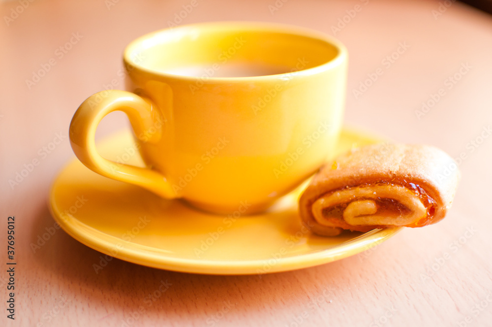 Coffee in an yellow cup Coffee in an yellow cup