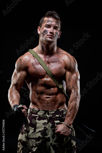 Muscular young sexy naked dirty soldiers with knives