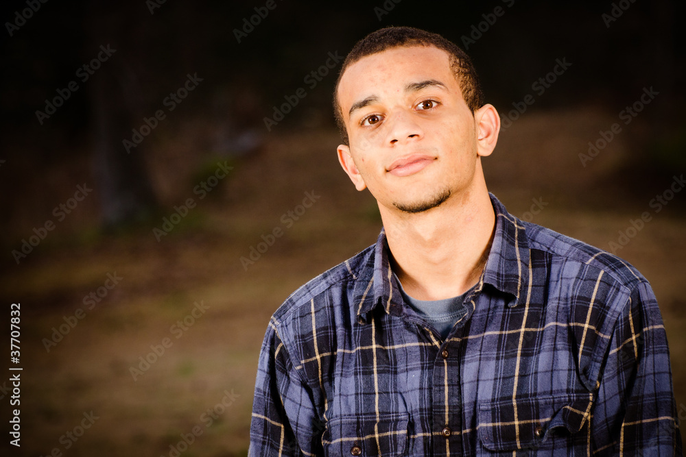 Portrait of African-American teenager outdoors