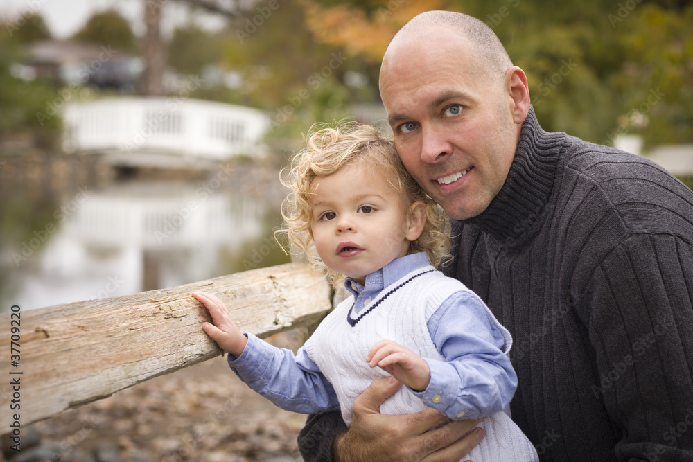 Handsome Father and Son in the Park Handsome Father and Son in the Park