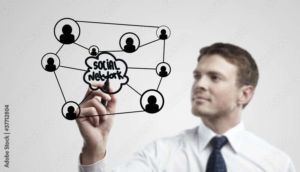 Young business man drawing a social network Young business man drawing a social network