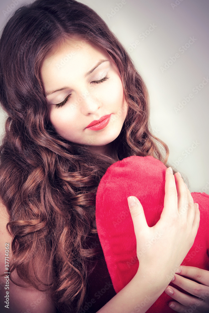 portrait of beautiful young girl with heart in hands portrait of beautiful young girl with heart in hands