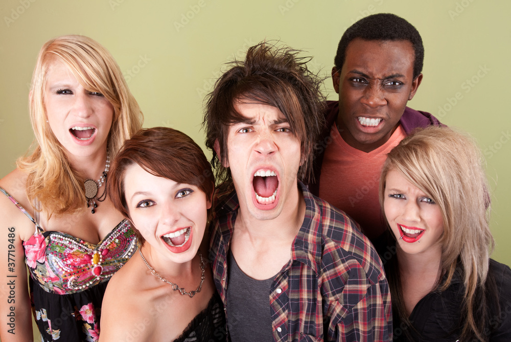 Angry urban teens shout at the camera. Angry urban teens shout at the camera.