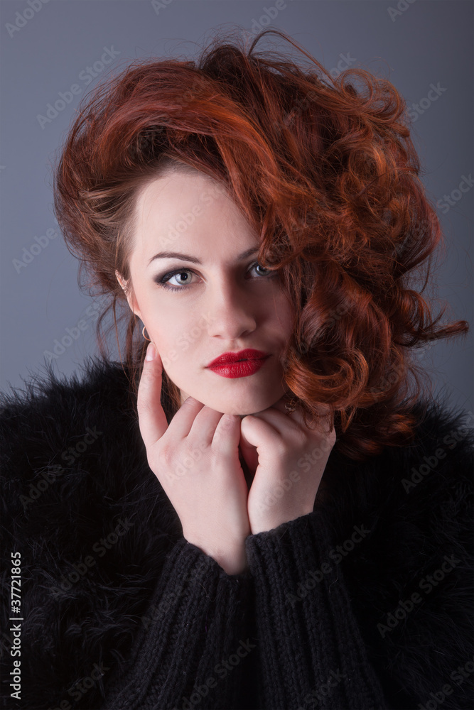 portrait of a curly red-haired girl with red lips