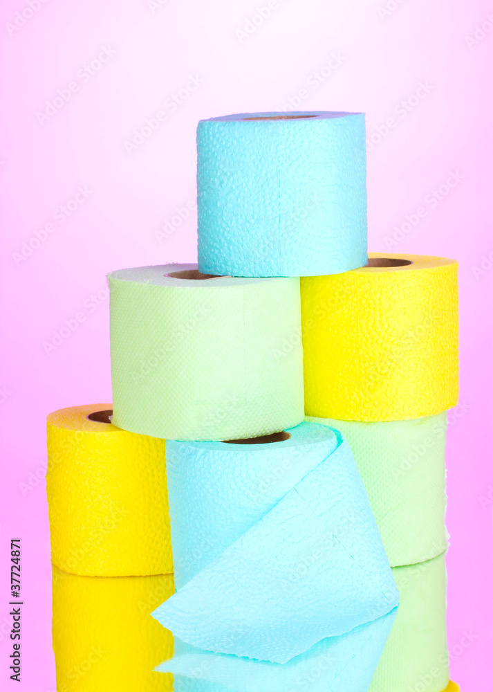 bright rolls of toilet paper on pink background bright rolls of toilet paper on pink background