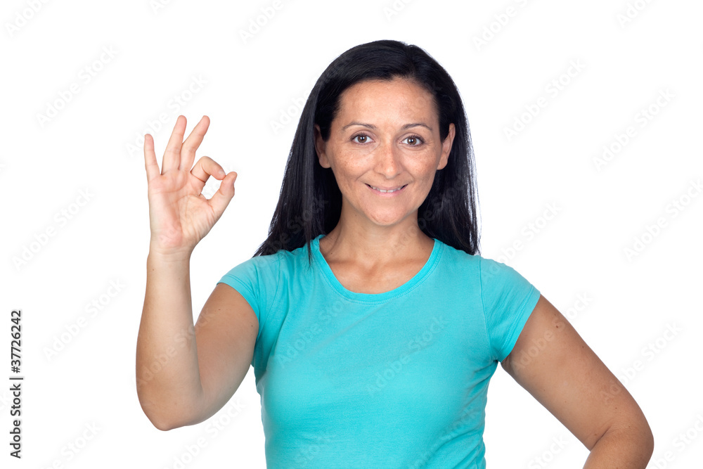 Adorable woman with blue t-shirt saying Ok Adorable woman with blue t-shirt saying Ok