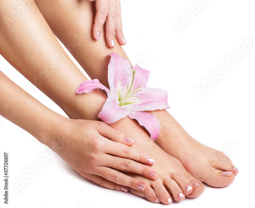 Female legs and hands with flower