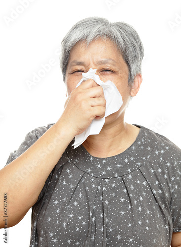 sneezing mature woman