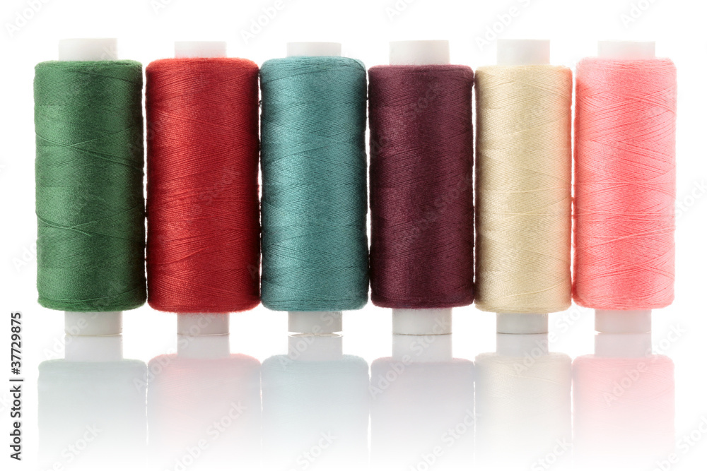 thread on reel coloured isolated on white background thread on reel coloured isolated on white background
