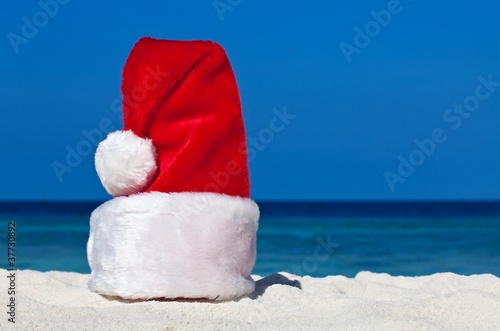 Santa hat is on a beach