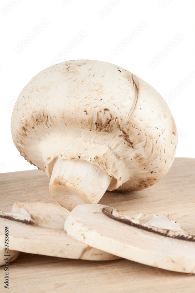 Fresh mushrooms on the wooden breadboard Fresh mushrooms on the wooden breadboard