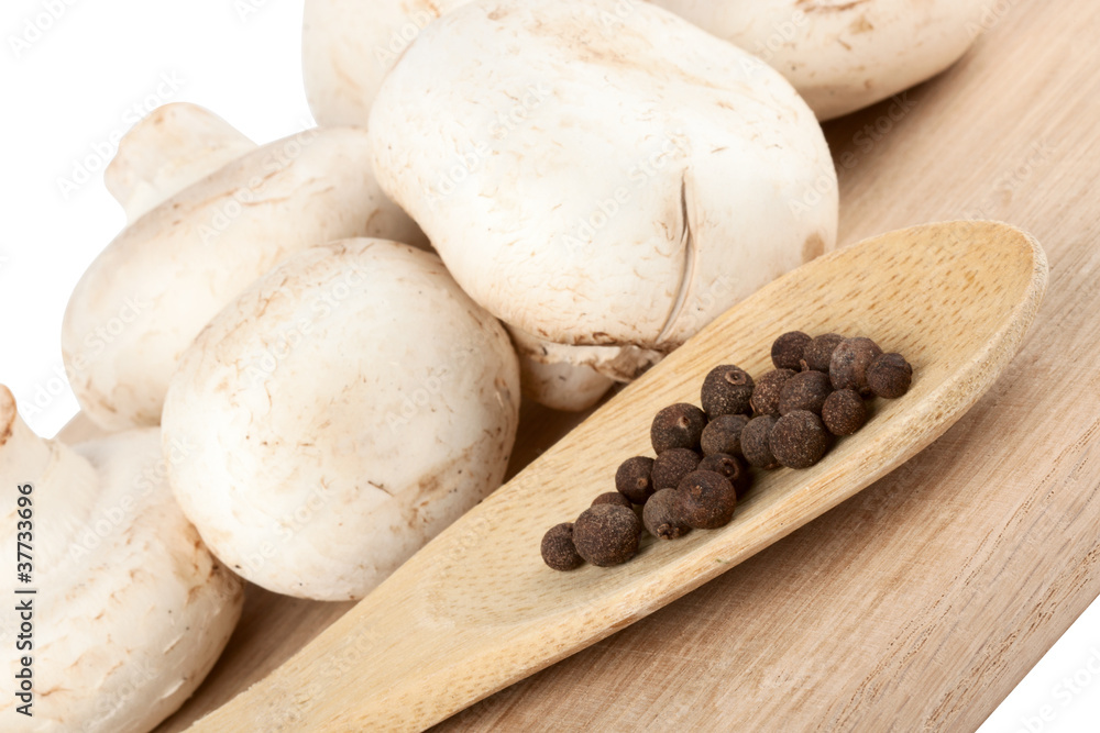 Fresh mushrooms with spoon of pepper Fresh mushrooms with spoon of pepper