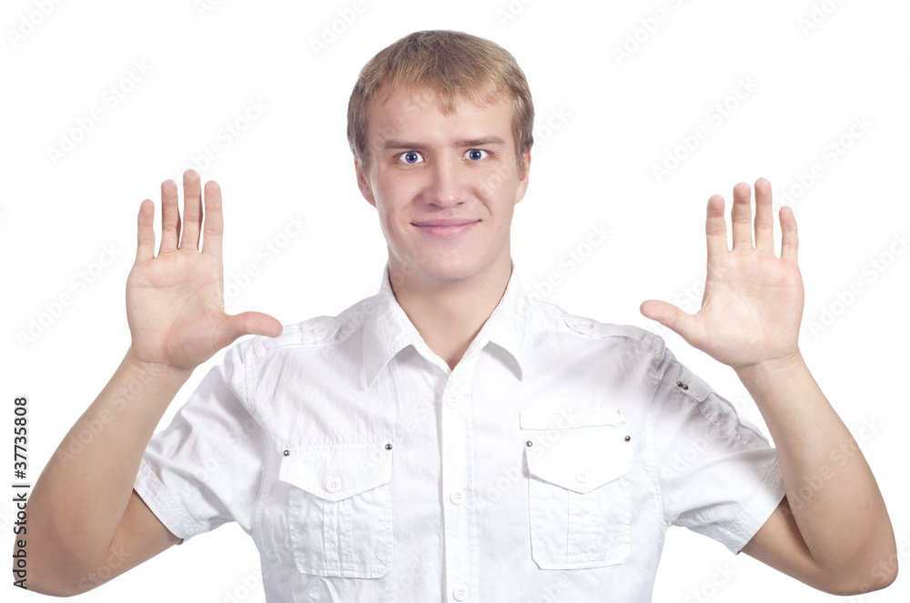 Young handsome male model with hands in front of the face Young handsome male model with hands in front of the face