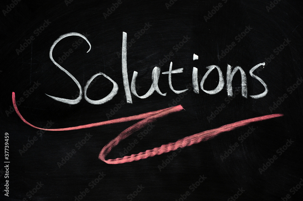 Obraz premium Solutions written on blackboard