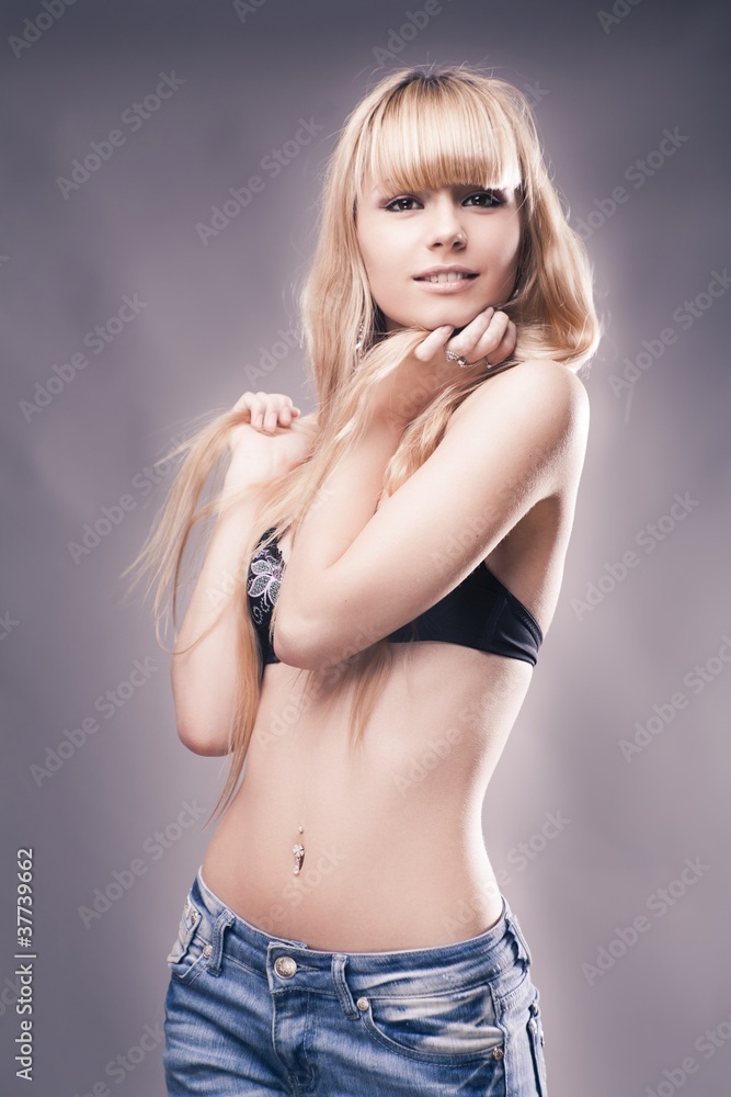 beautiful young girl over gray background beautiful young girl over gray background