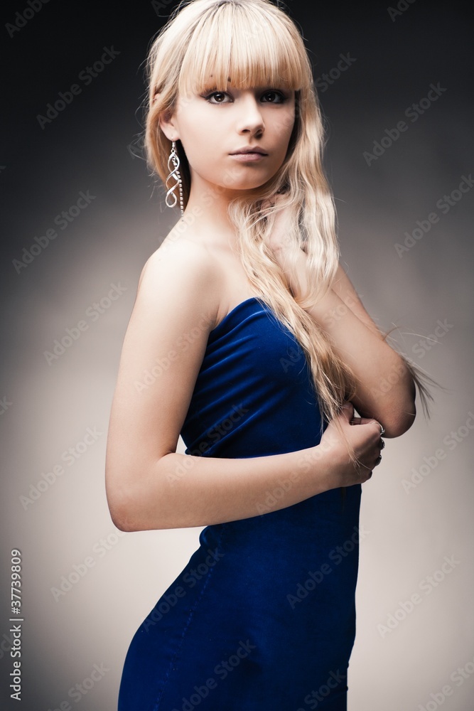 beautiful young girl over gray background beautiful young girl over gray background
