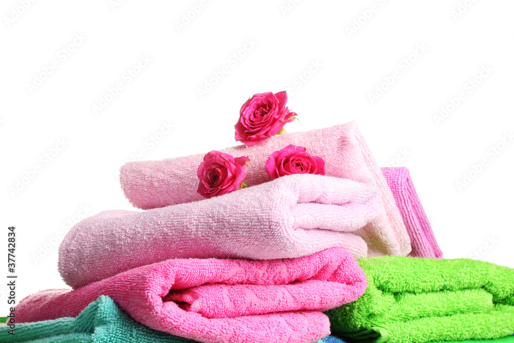 Colorful towels with roses on a white background Colorful towels with roses on a white background