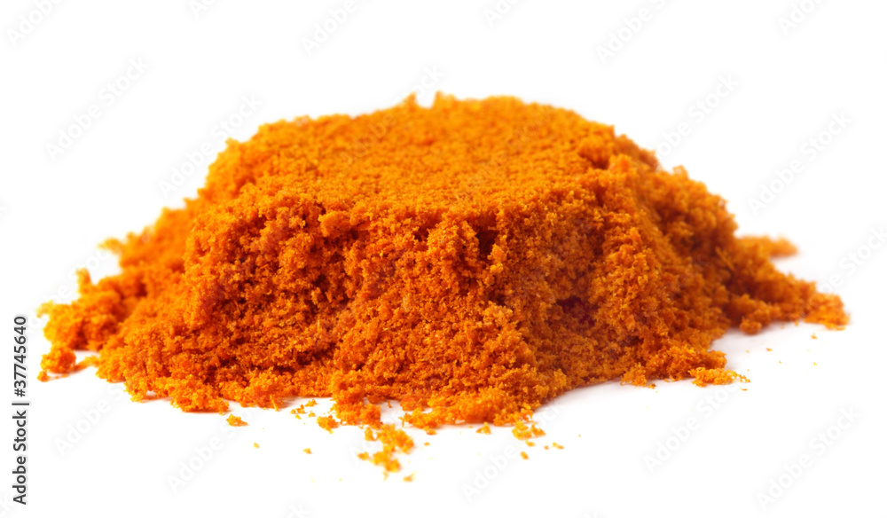 Pile of ground peppers over white background Pile of ground peppers over white background