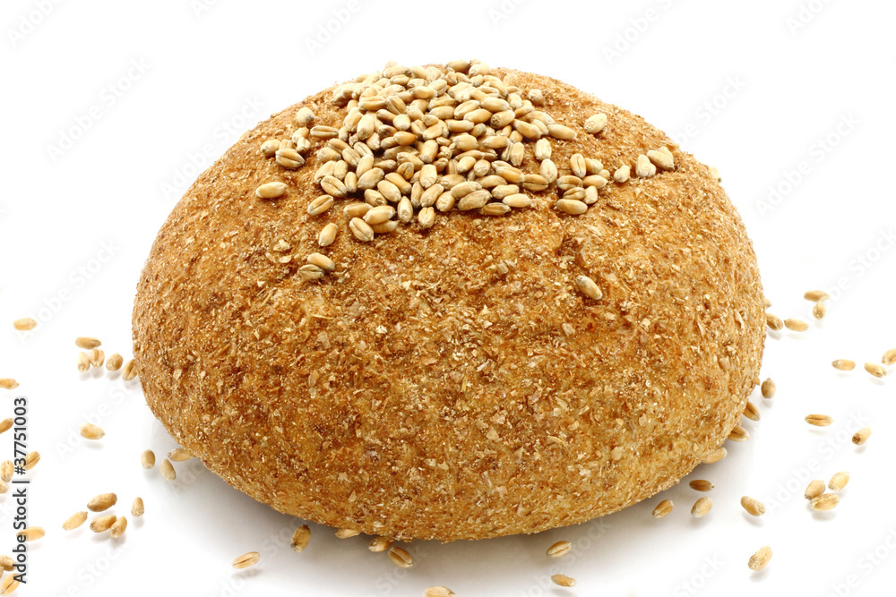 Bread and wheat seeds on a white background