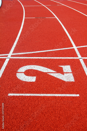 Number 2 on the start of a running track