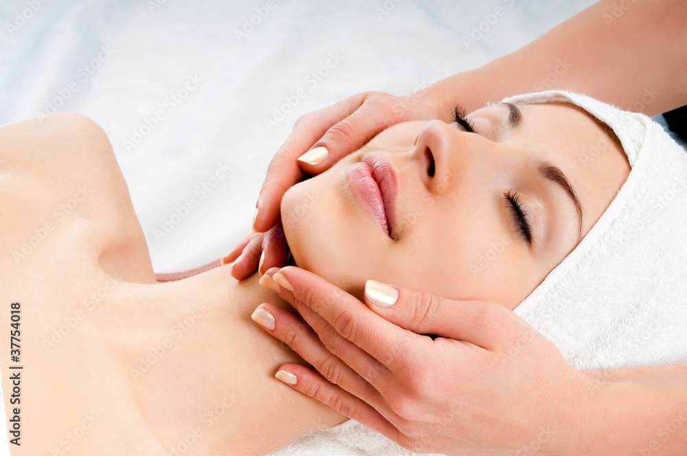 woman receiving facial massage