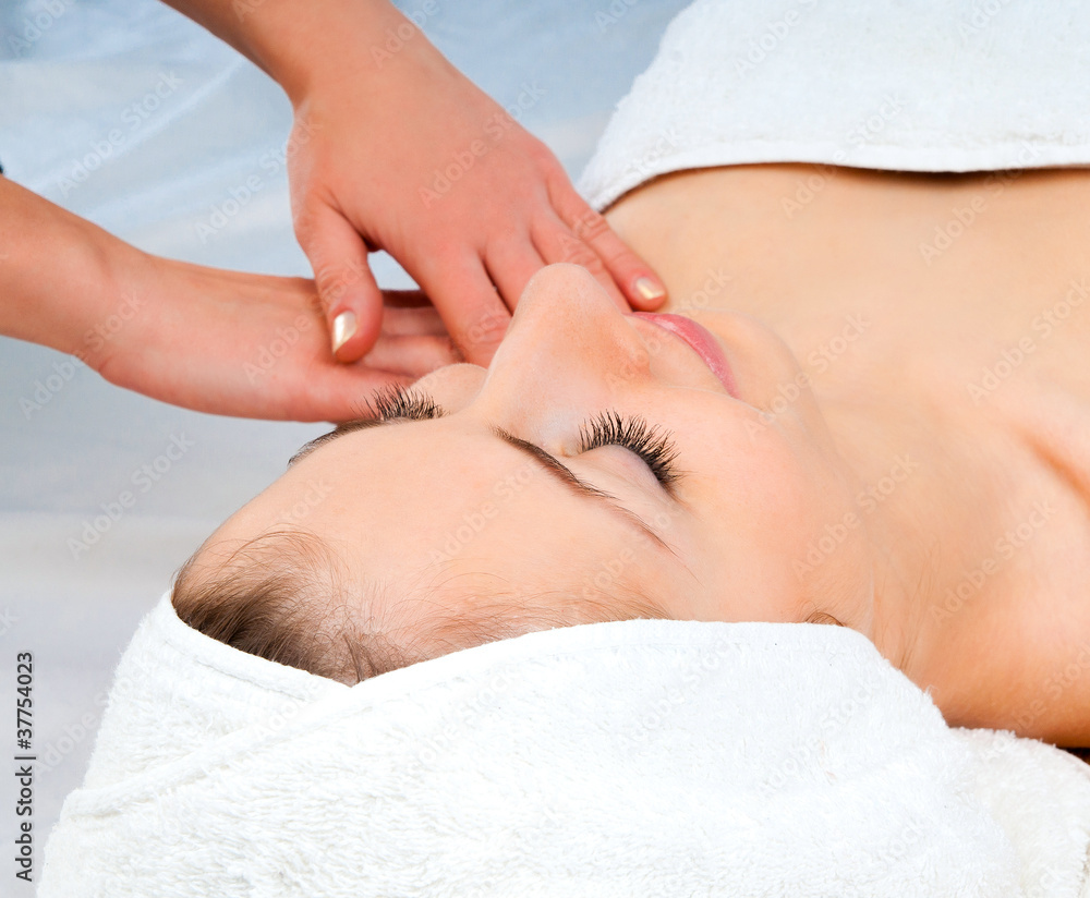 woman receiving facial massage woman receiving facial massage