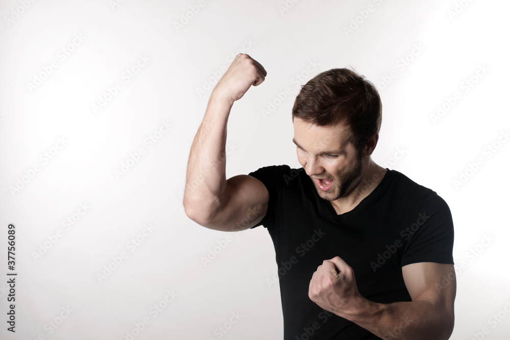 A young man cheers A young man cheers