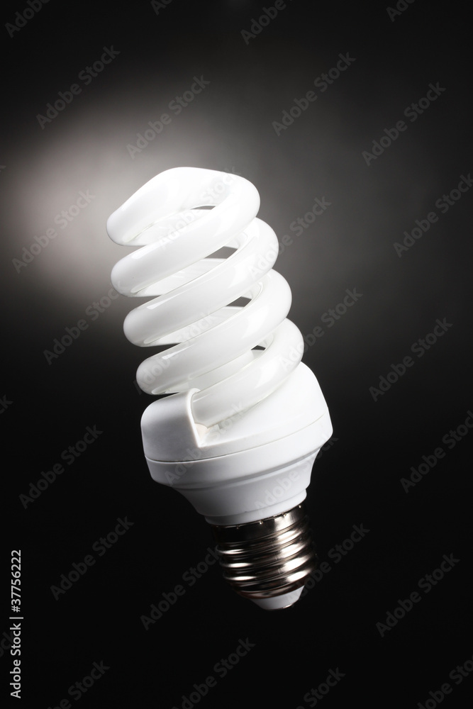 Energy saving lamp on black background Energy saving lamp on black background