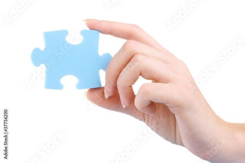 Hand and puzzle, isolated on white