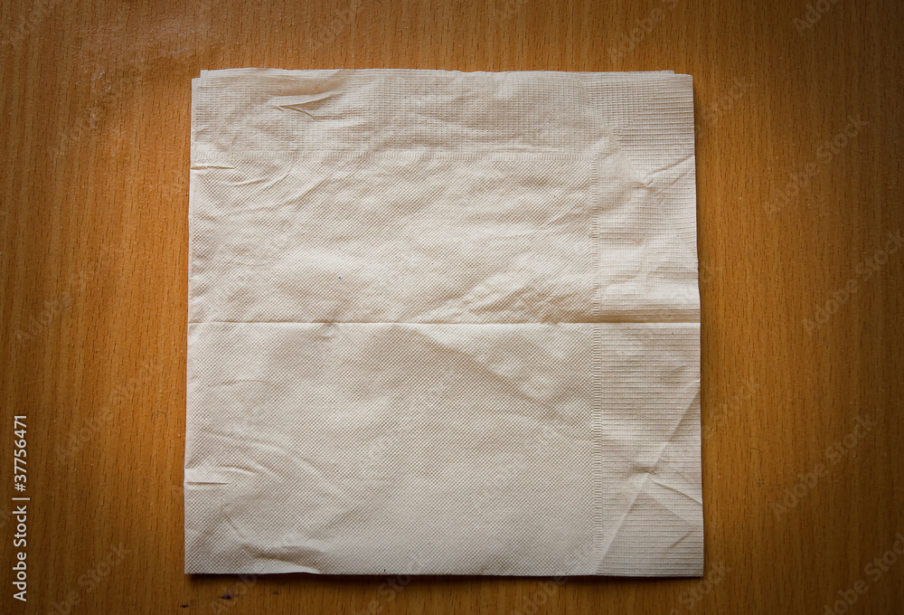 beige cocktail napkin on wooden