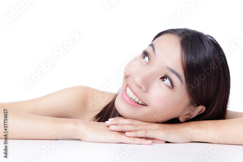 Face of beautiful girl smile looking up with healthy skin care