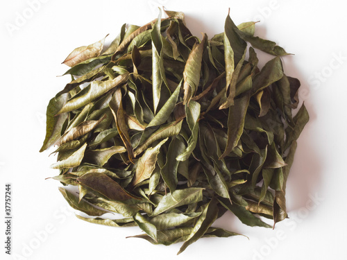 close up of a heap of indian dried curry leaves