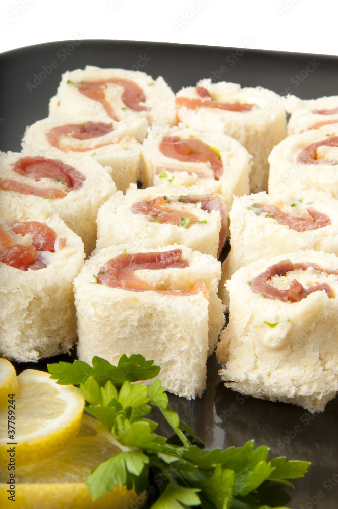 Smoked salmon rolls on white background Smoked salmon rolls on white background