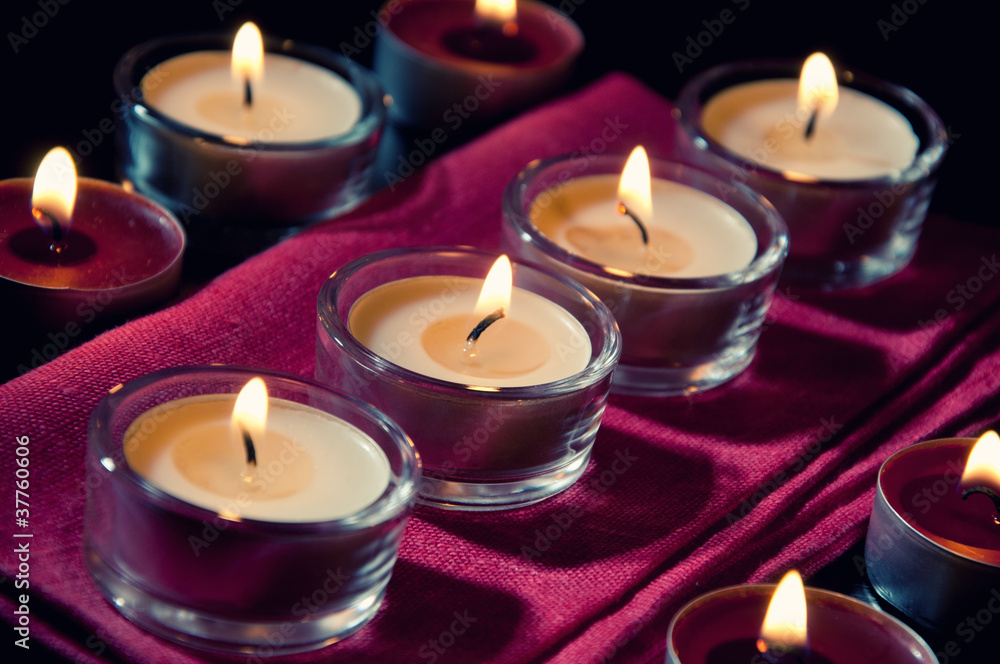 Burning tea light candles, close-up Burning tea light candles, close-up