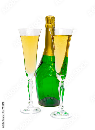 glasses and a bottle of champagne on a white background