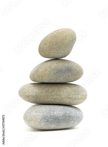 Stack sea pebbles against a white background