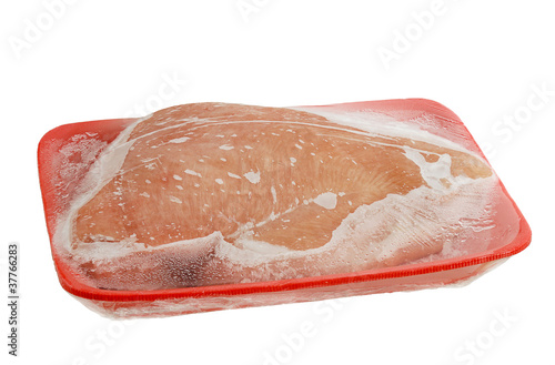 Frozen raw turkey breast on foam meat tray