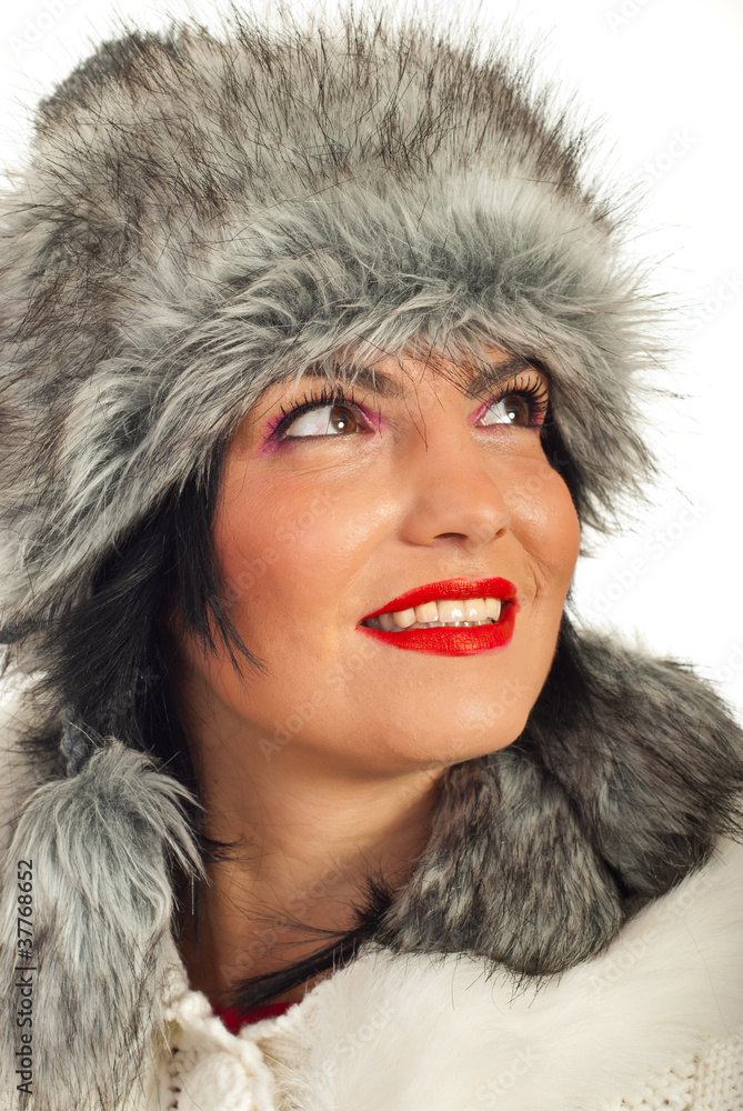 Elegant woman in fur hat looking up Elegant woman in fur hat looking up