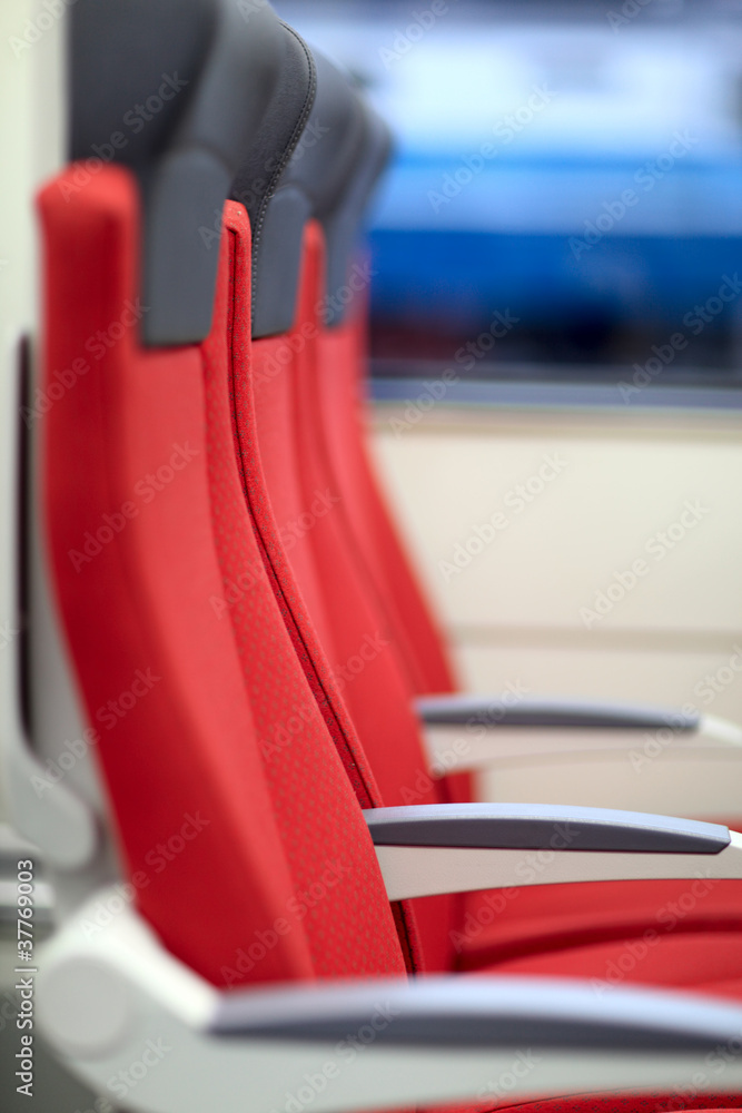 Red chairs in train Red chairs in train