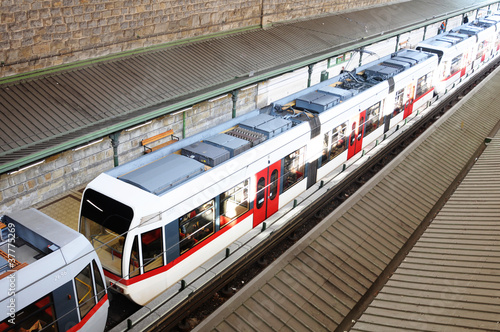Modern speed train standing on a station. top view