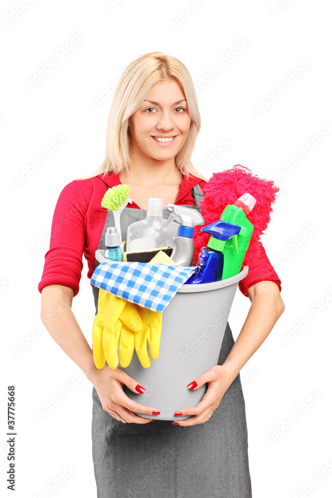 Female cleaner holding a bucket with cleaning supplies Female cleaner holding a bucket with cleaning supplies
