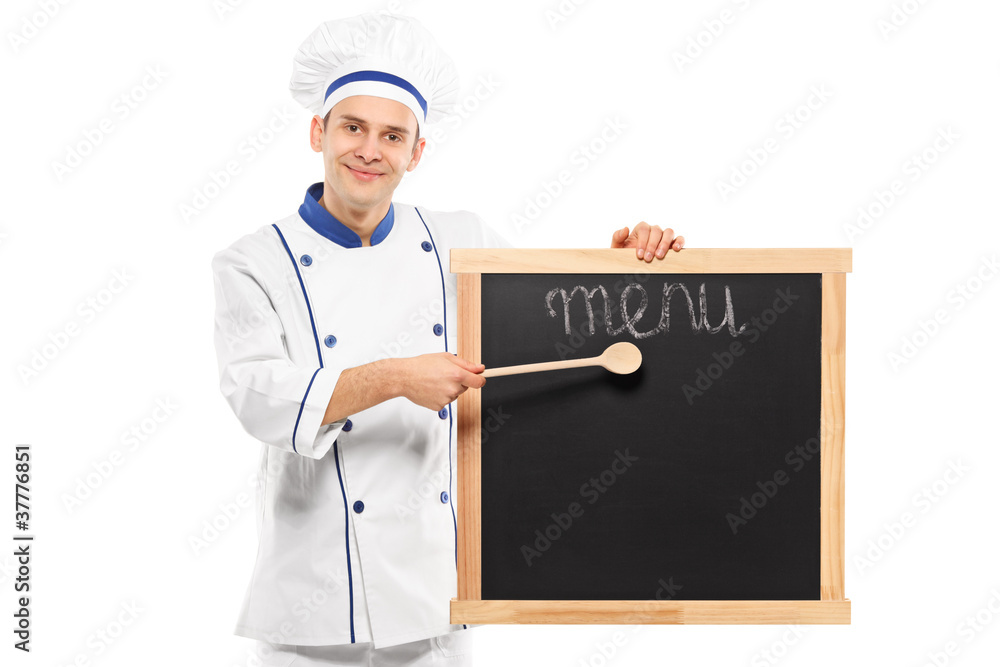 Portrait of a smiling chef pointing on a board Portrait of a smiling chef pointing on a board