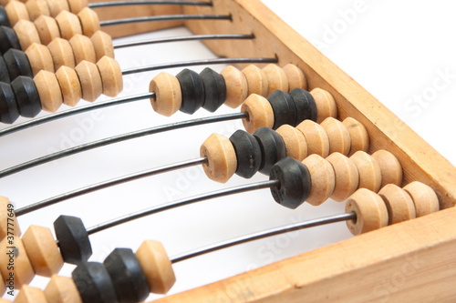 Old wooden abacus with a calculated sum