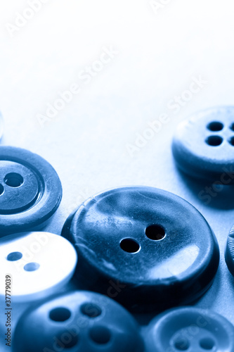 A pile of buttons in blue