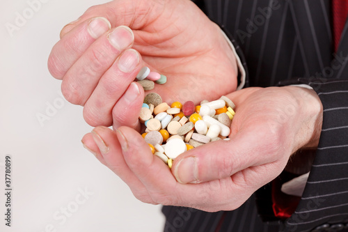 man holding pills