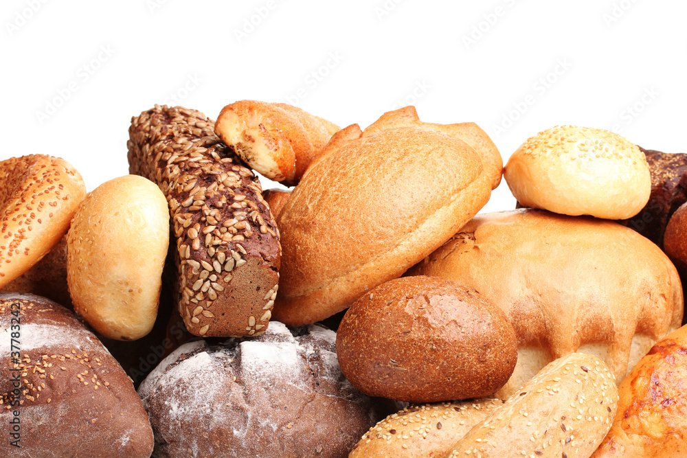 tasty breads and rolls isolated on white
