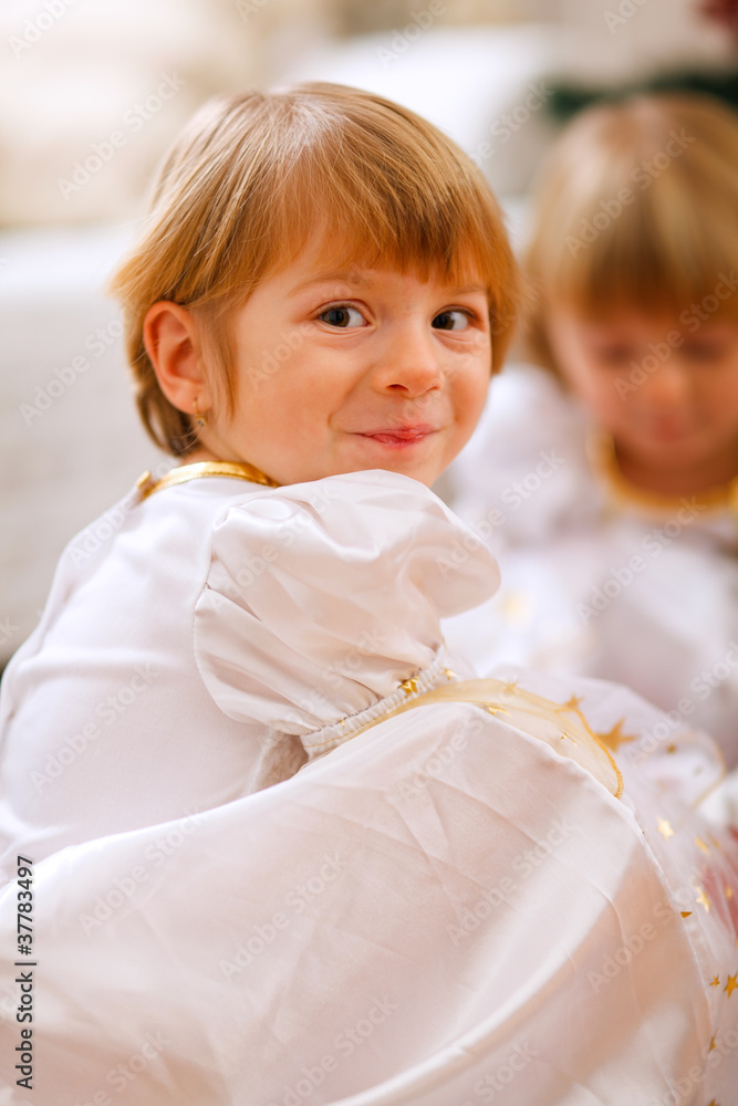 Fototapeta premium Portrait of happy girl playing with sister