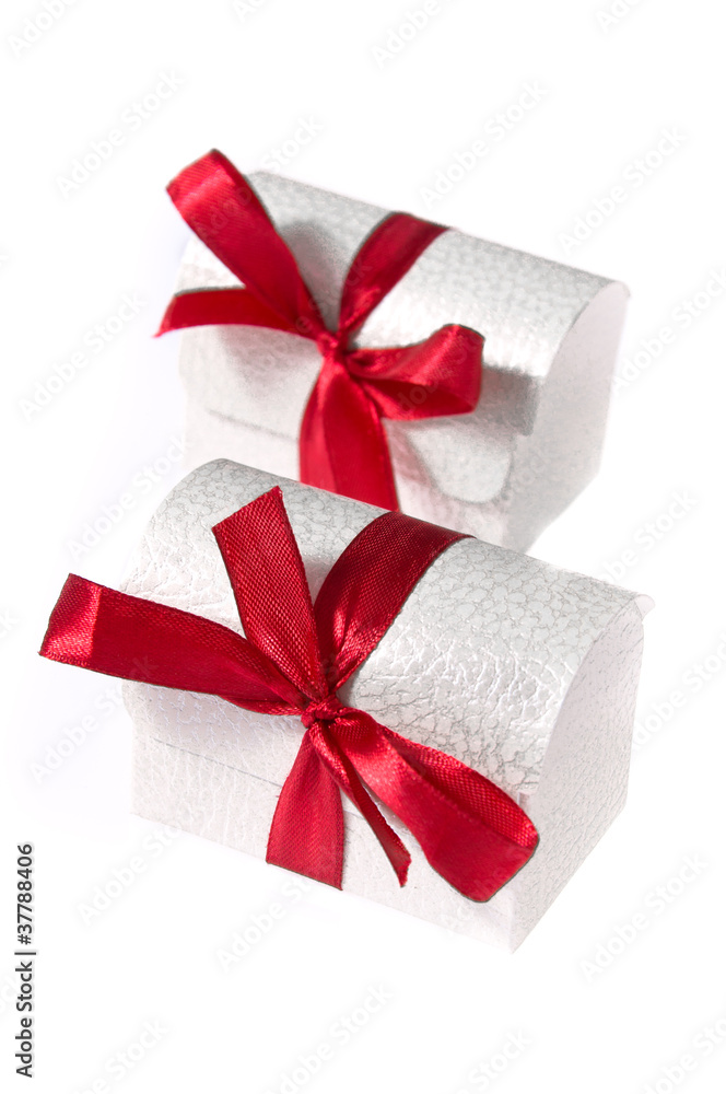 Two white boxes with ribbons isolated on white Two white boxes with ribbons isolated on white