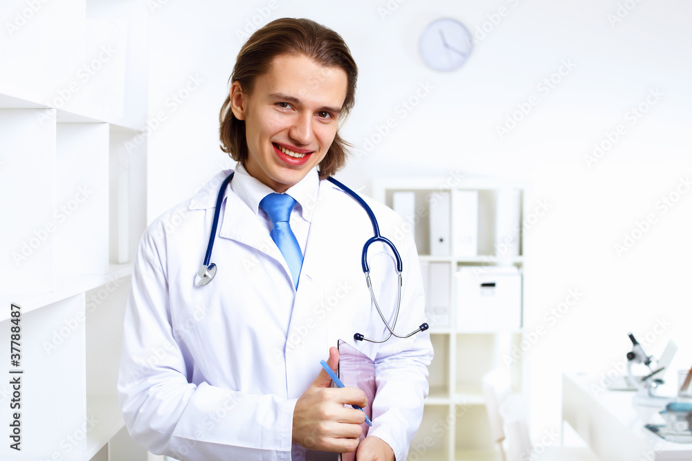 Friendly doctor in medical office Friendly doctor in medical office